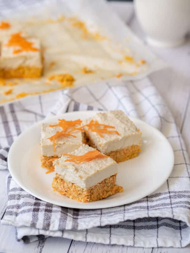 Carrot cake bars on a plate with a napkin.