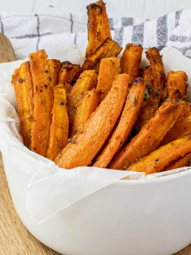 Roasted sweet potato fries in a white bowl.