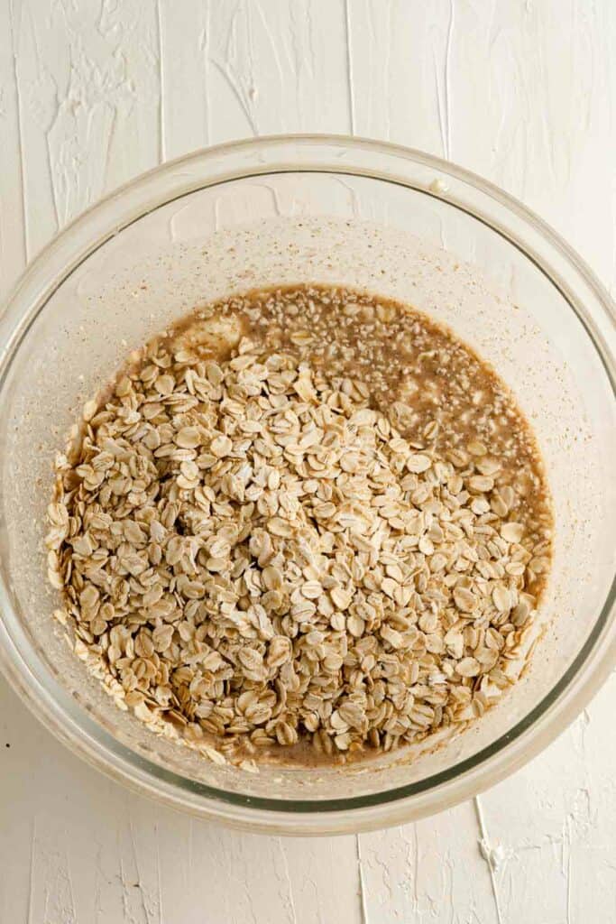 A glass bowl filled with oats.