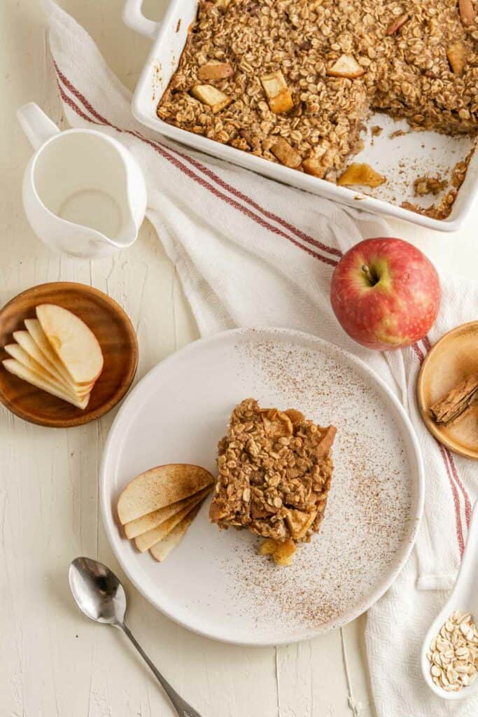 A piece of apple crumble cake on a plate.