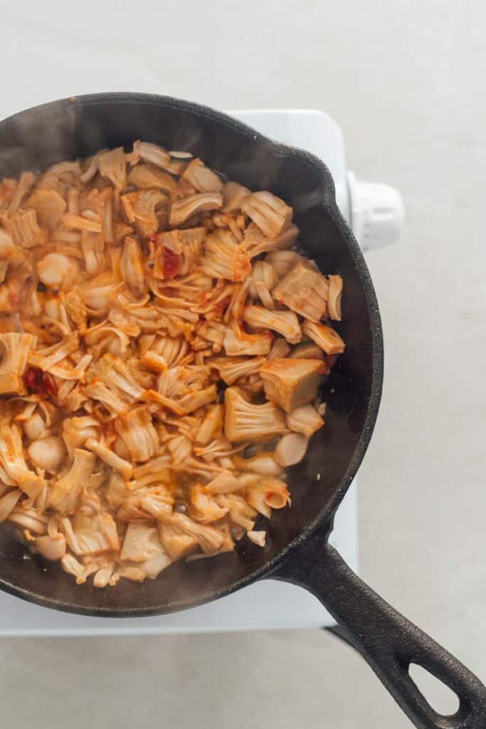 A frying pan filled with shredded jackfruit.