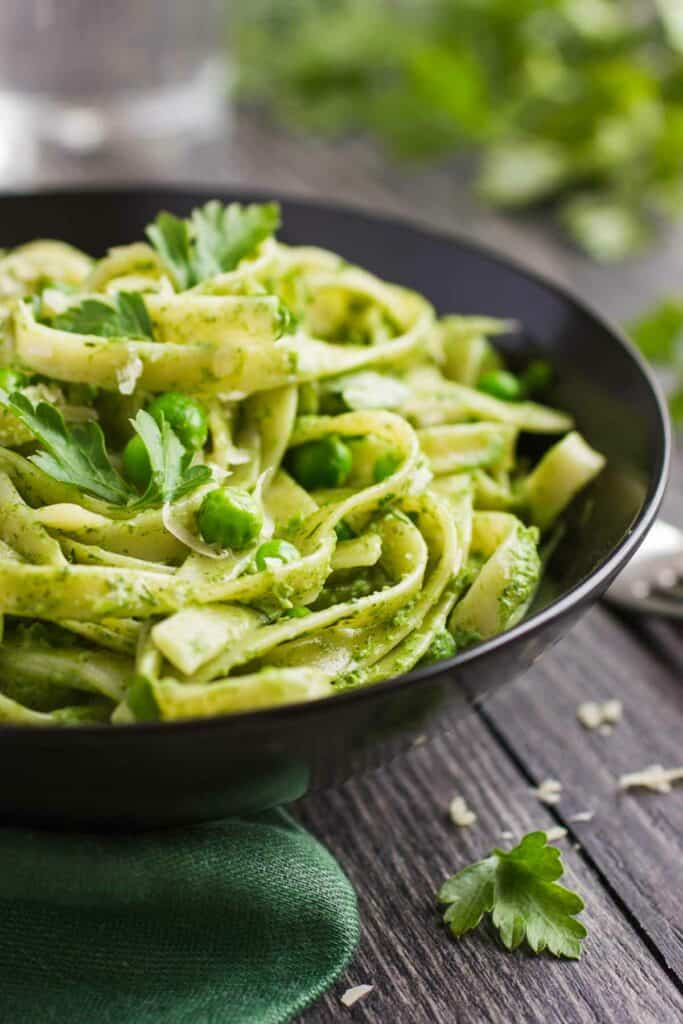 Pesto pasta with peas and parsley.