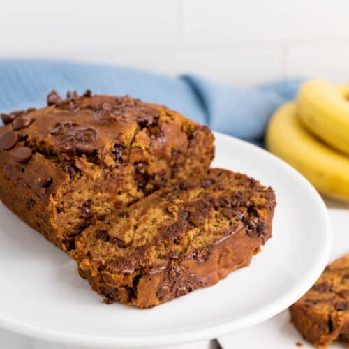 A loaf of gluten-free banana chocolate bread on a plate.