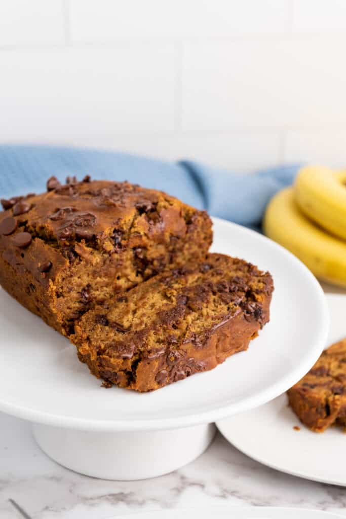 A loaf of gluten-free banana chocolate bread on a plate.