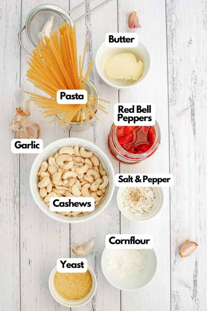 The ingredients for a pasta dish are shown on a white background.