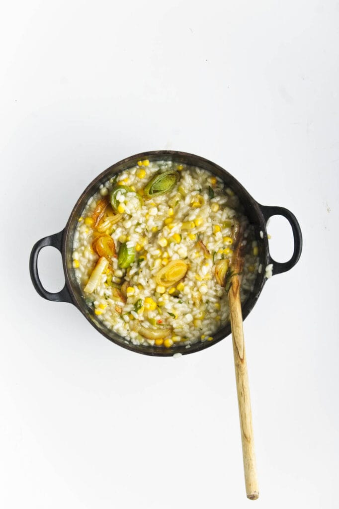 Sweet corn and leek risotto in a pot.
