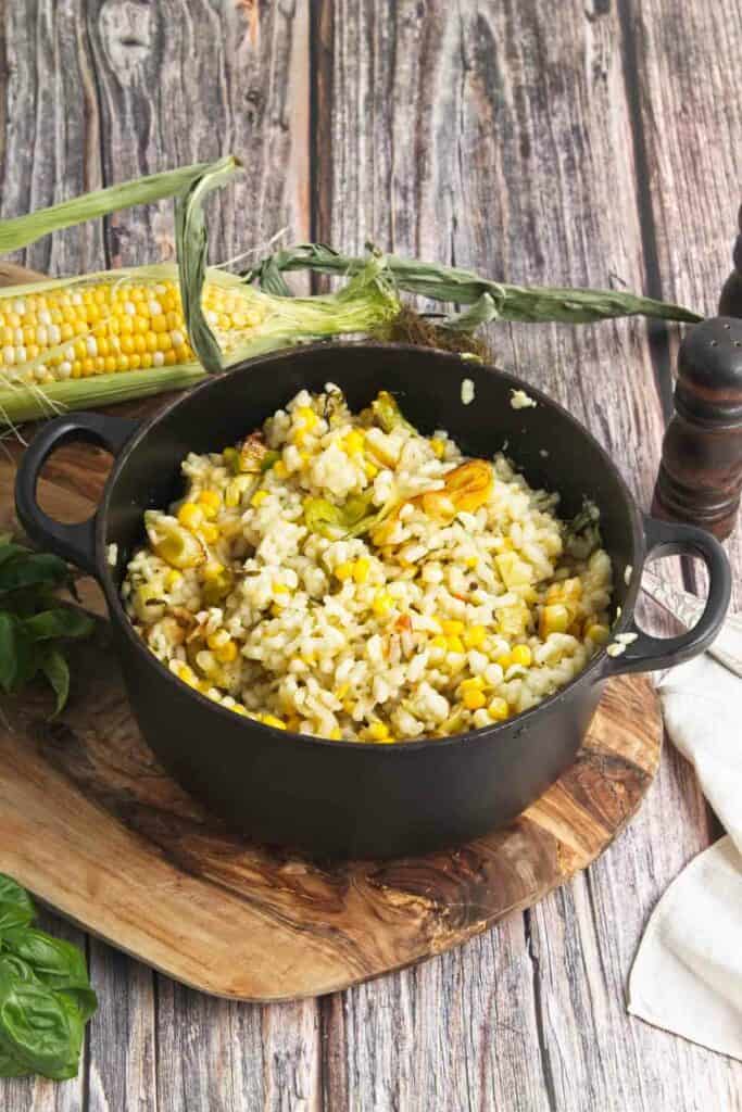 A skillet with sweet corn risotto.