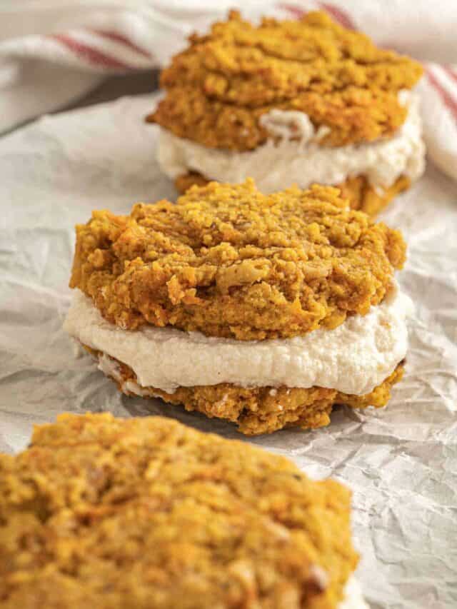 Three oatmeal cream pies stacked with visible creamy filling.