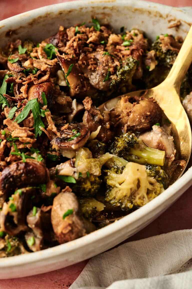 Savory vegan mushroom and broccoli casserole with herbs and crispy toppings, perfect for plant-based dinners.