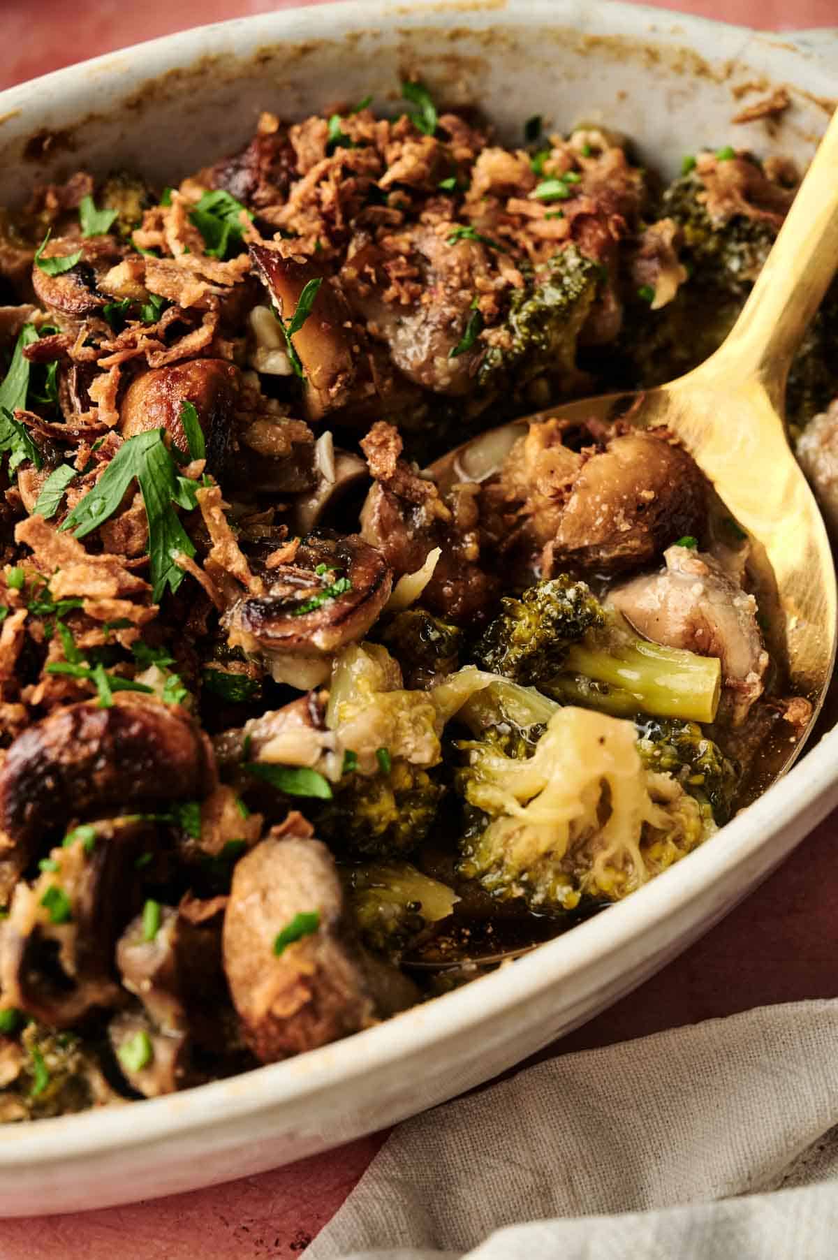 Savory vegan mushroom and broccoli casserole with herbs and crispy toppings, perfect for plant-based dinners.